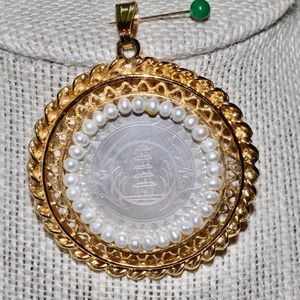 Antique gambling chip pendant